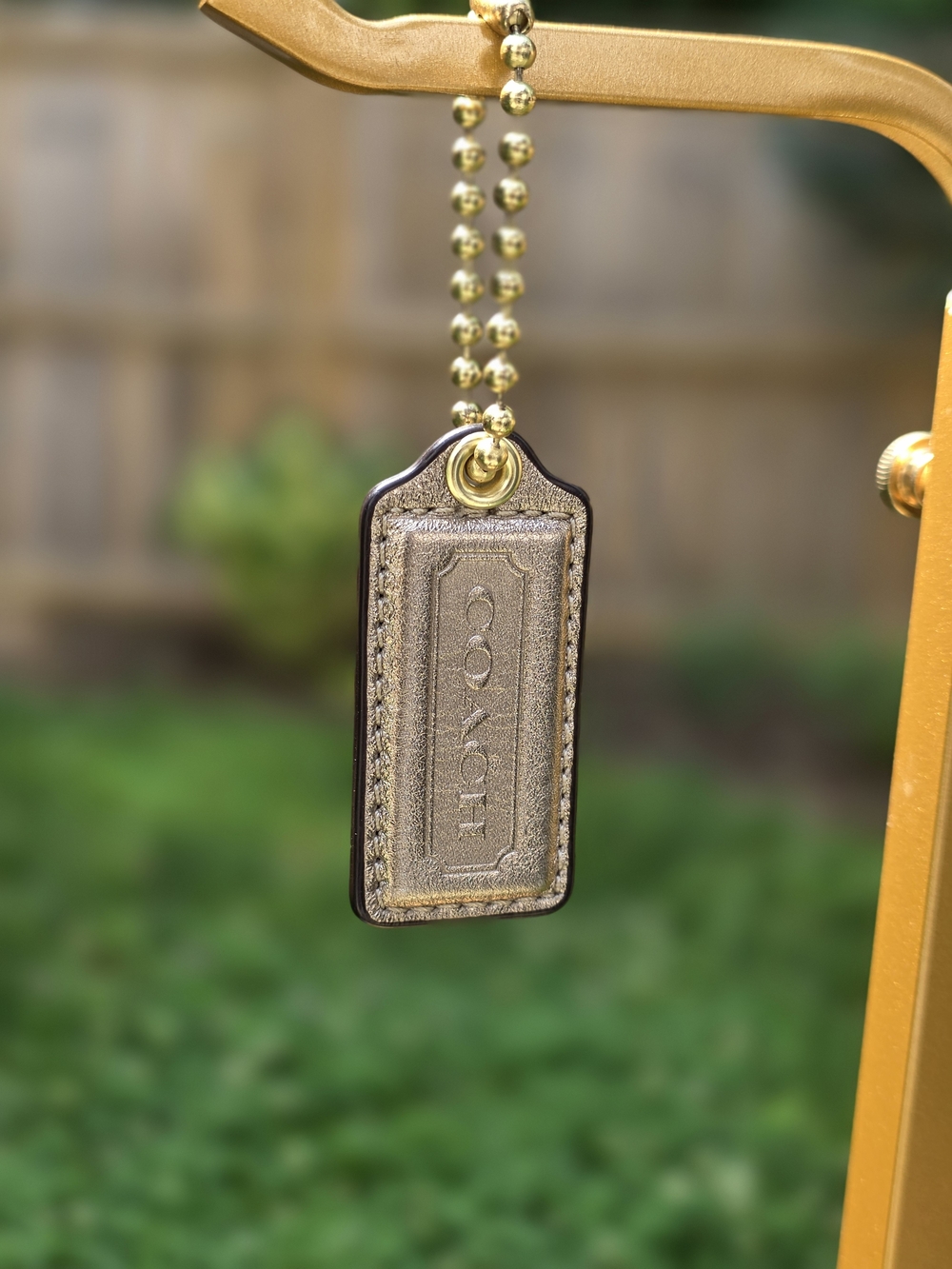 COACH Metallic Gold Leather Hangtag W/ Fold Ball Chain